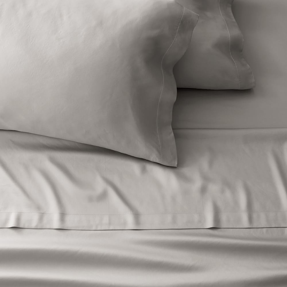 grey bed sheets and pillowcases